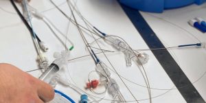 Hands assembling catheter tubing for stent delivery systems