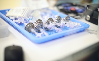 Tray of single-use luer connector components prepared for kitting