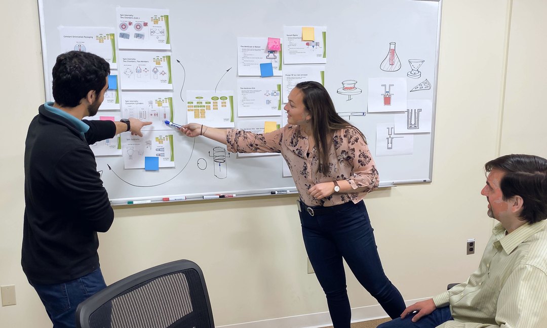 Tooling team planning a program on a whiteboard